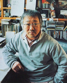 A picture of Katsuhiro Otomo looking at the camera